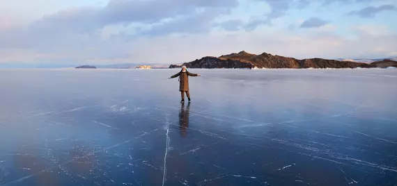 person standing on a frozen lake