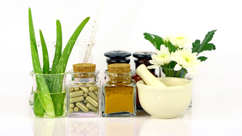 various natural therapies, including plants and herbs, against a white background