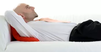 man lying on couch