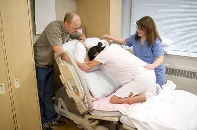 Woman in labor with support