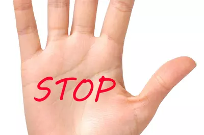 hand with STOP on it