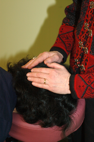 close up of hands on a head