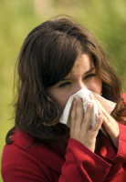 Woman sneezing