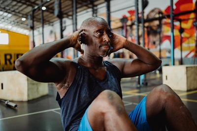 man doing situps in a gym