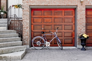 bicycle parked in front of a garage door