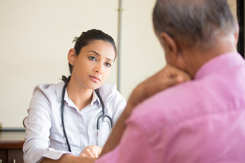 doctor listening to patient talk