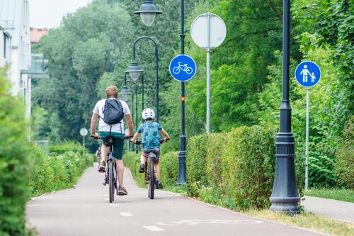 2 people riding bikes together