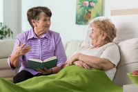 elderly friends visiting in hospital