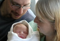 parents with newborn baby