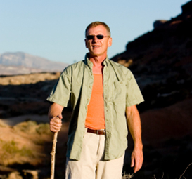 Middle-aged man hiking.