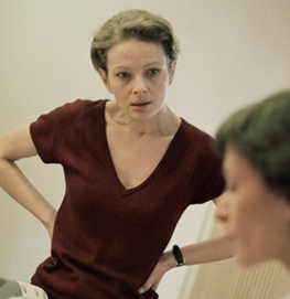 Two women having a serious conversation.