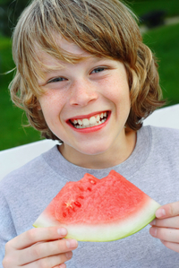 boy eating watermelon