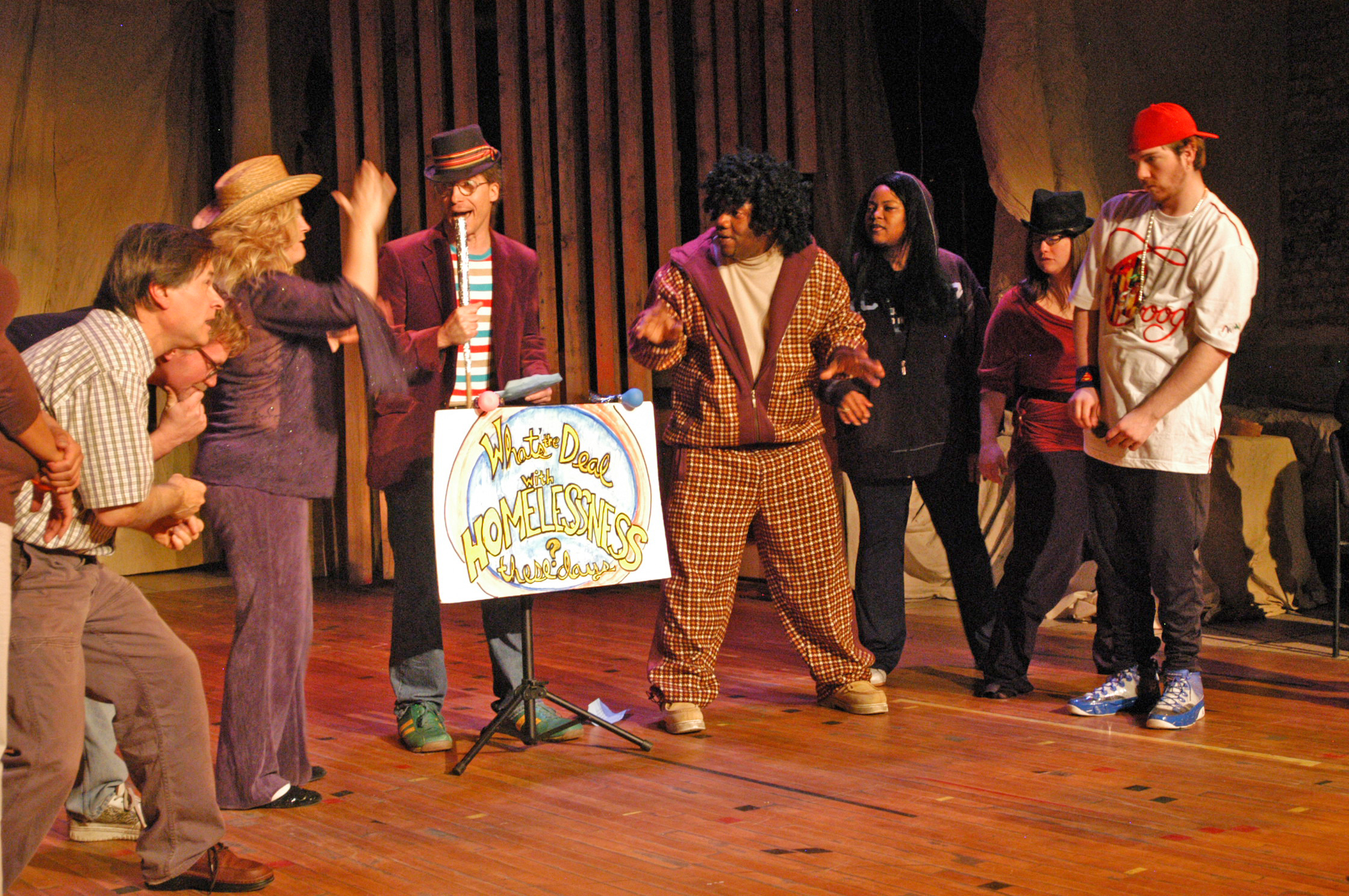 Theater troupe zAmya performs on stage.