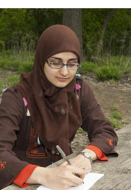 woman writing to identify values