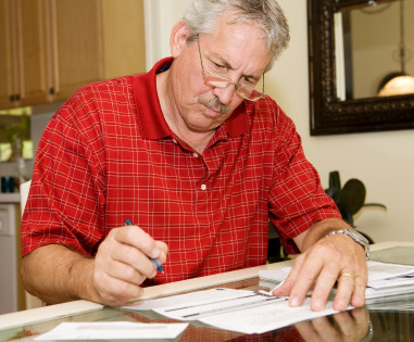 Man%20paying%20bills_0.jpg