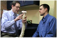 Chiropractor discussing treatment