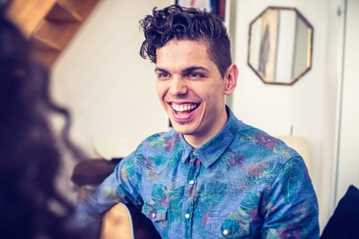 young man laughing with friends