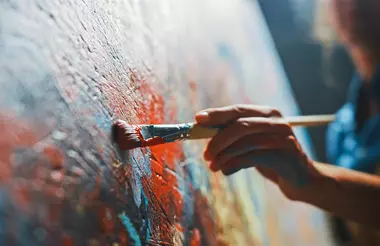 artist working on an oil painting