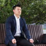 person sitting on bench