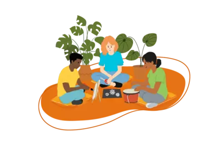 Three people sitting on the ground painting, playing a drum and crafting