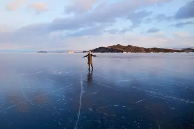 person standing on a frozen lake