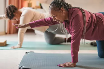 two women doing yoga