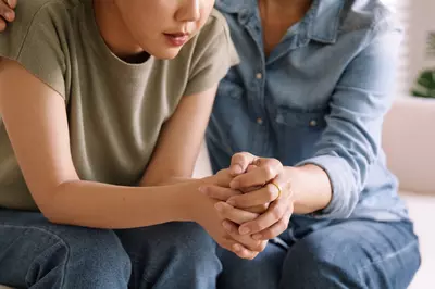 woman being comforted