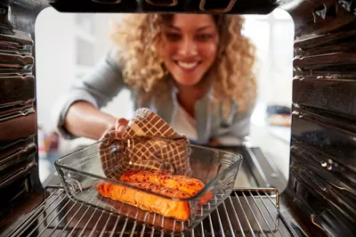 woman baking salmon