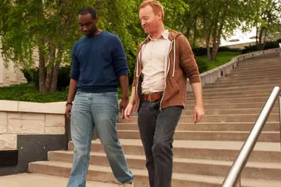 two people walking down stairs