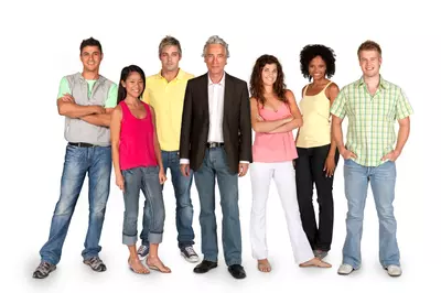 group of people sitting on a hillside together