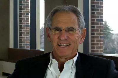 Jon Kabat-Zinn smiling at the camera