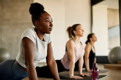 3 people doing yoga together