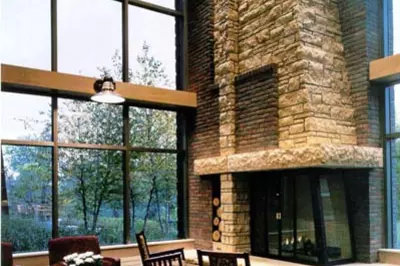 a seating area with a large fireplace