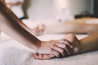 Acupressure being performed on feet