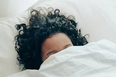 Person reluctant to get out of bed.