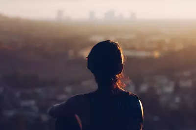 person looking over large city from above