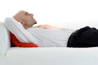 man lying on couch