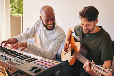 Two men plays instruments