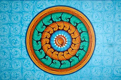 an image of a blue, green and orange mandala