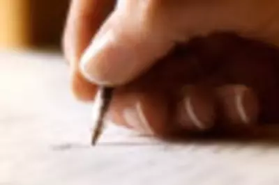 Hand writing in journal