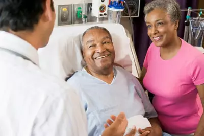 older couple speaking to a healthcare provider