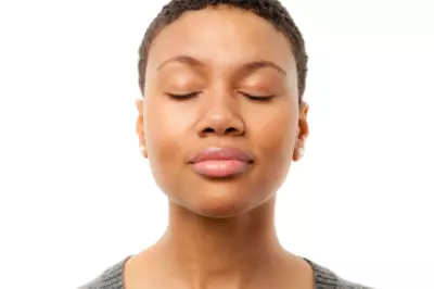 Peaceful woman with eyes closed.