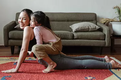 Family practicing yoga together.