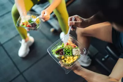 people eating healthy food at the gym