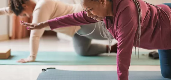 two women doing yoga