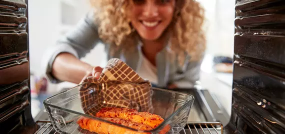 woman baking salmon