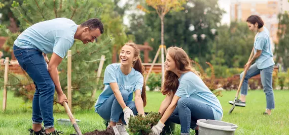 people having fun gardening together