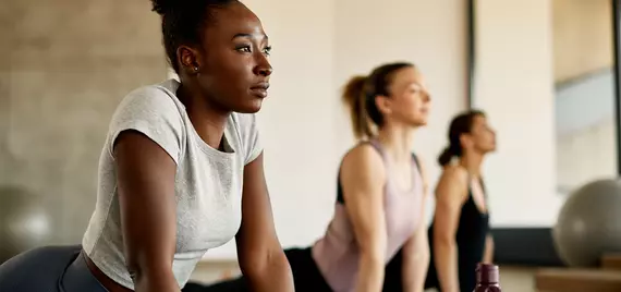 3 people doing yoga together
