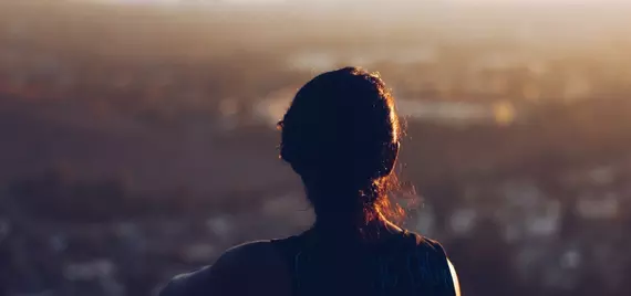 person looking over large city from above