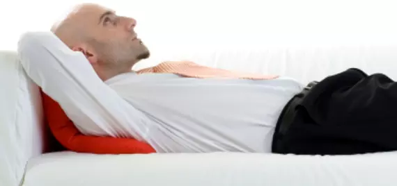 man lying on couch